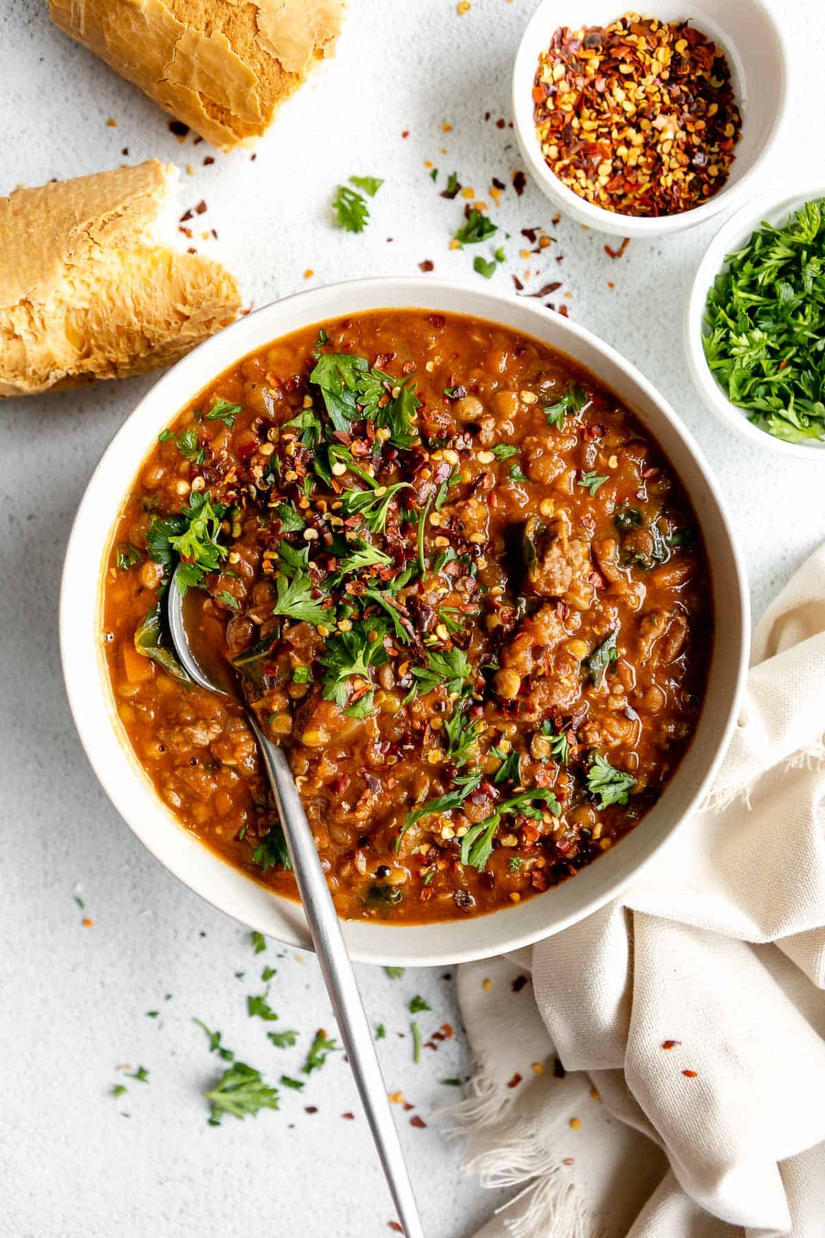 vegan instant pot lentil soup in a bowl with parsley
