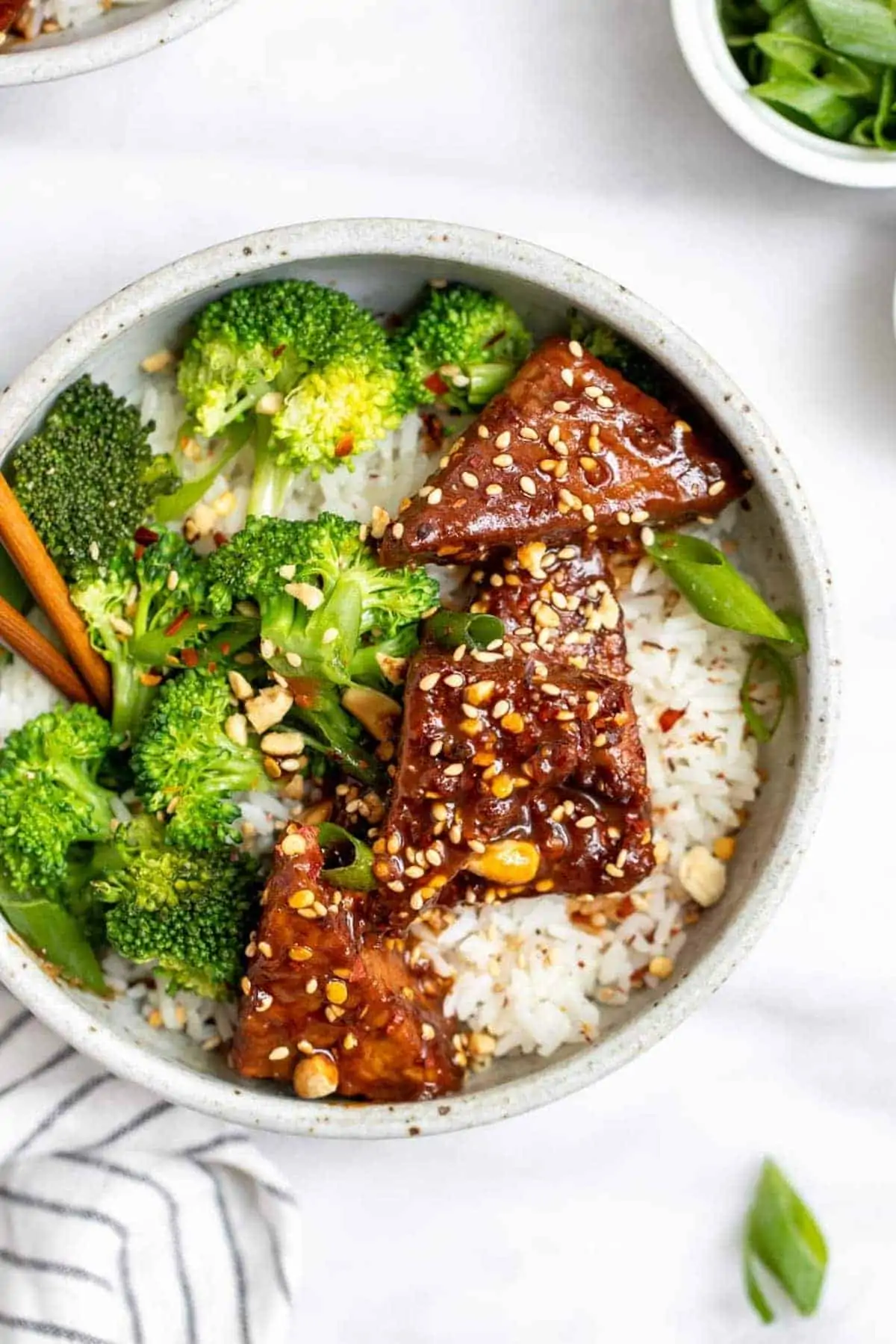 Vegan tempeh recipe with broccoli and rice in a small bowl. 